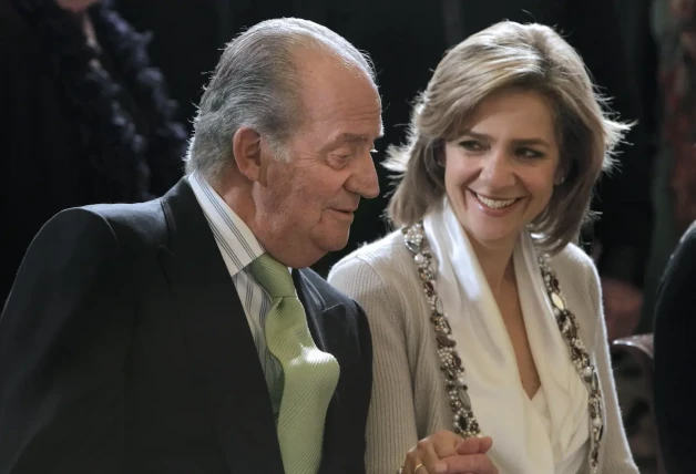 Juan Carlos con su hija Cristina