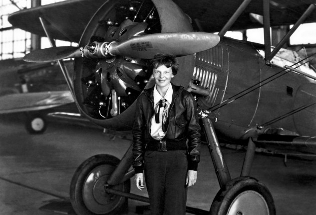 July 30, 1936 - Burbank, CA, United States of America - Aviation pioneer Amelia Earhart poses with her airplane in a hangar July 30, 1936. Earhart was the first female aviator to fly solo across the Atlantic Ocean