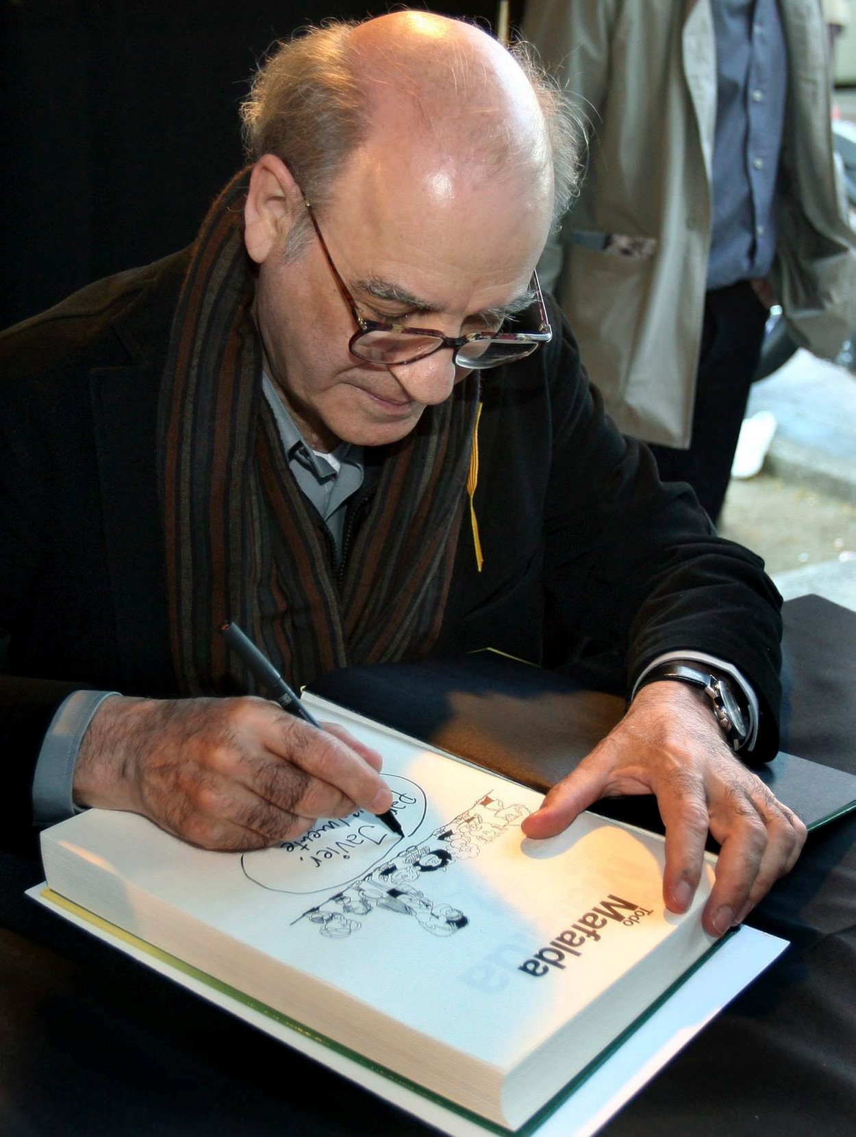El artista argentino Quino, en una firma de libros.