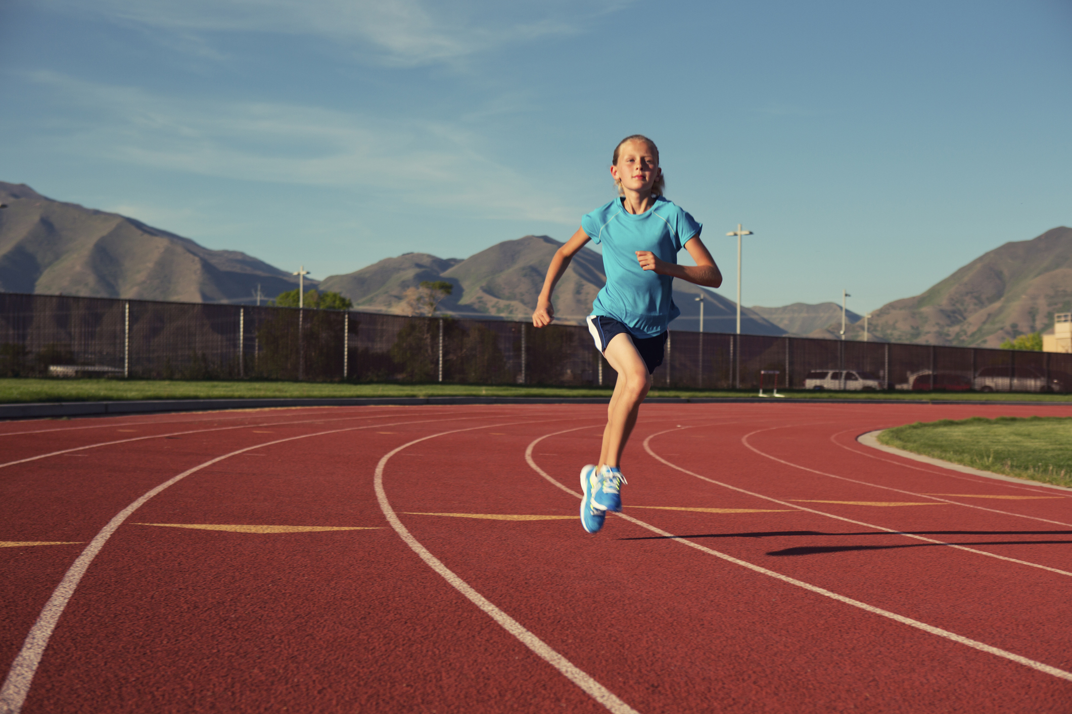 A young female track runner trains for her next race and is looking forward to a possible . future.