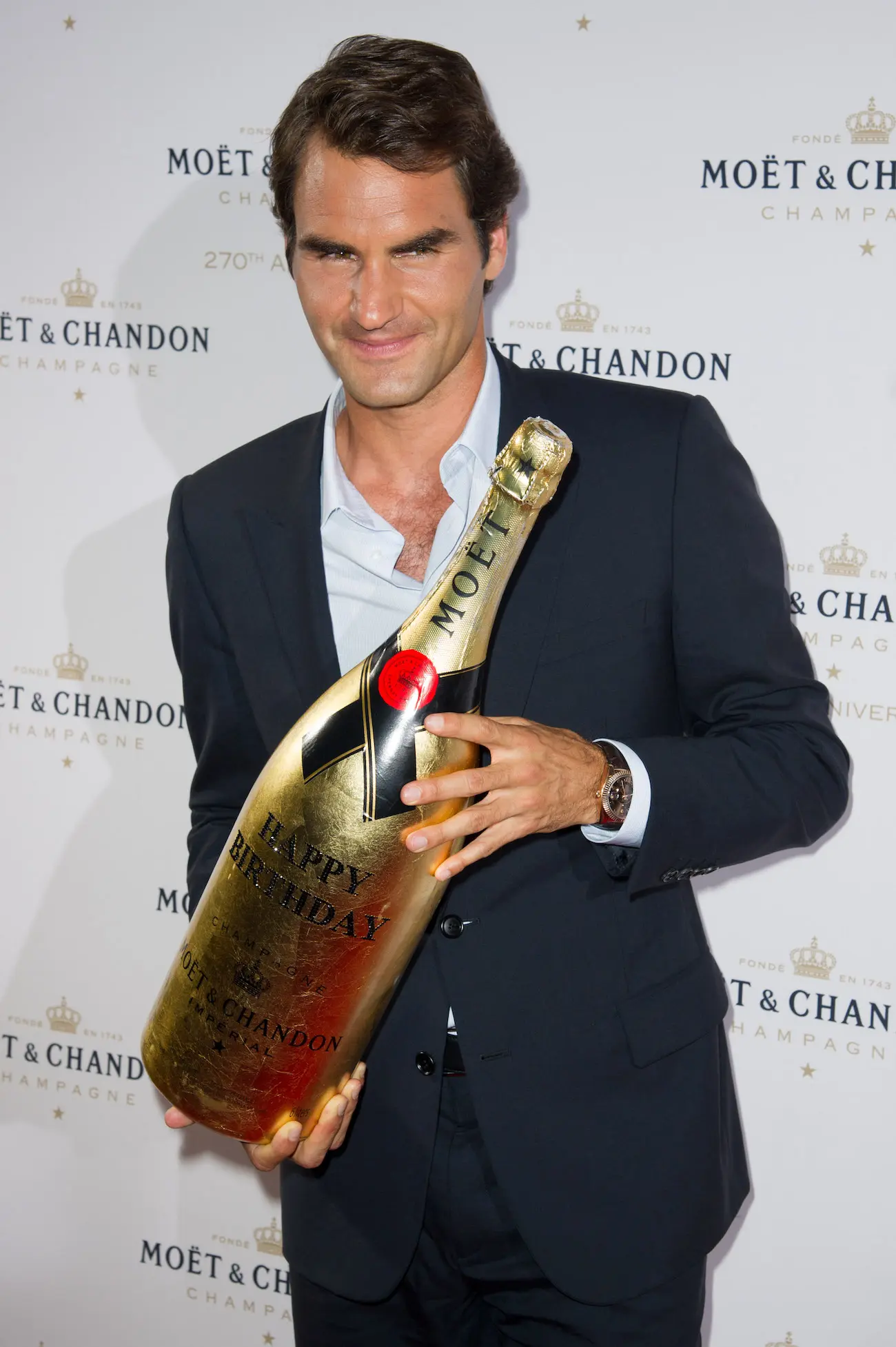 Federer con champan